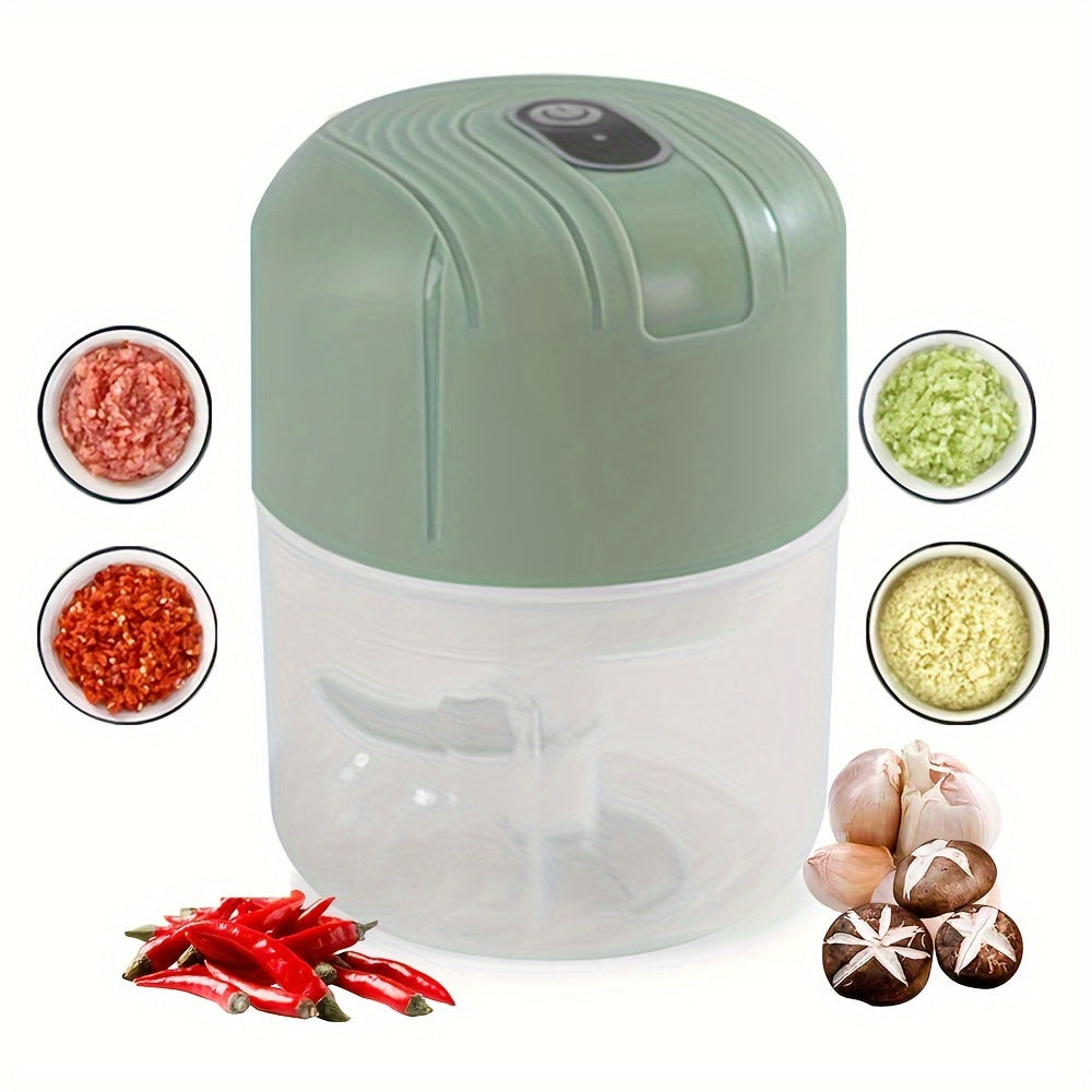 Round plastic container containing a portable multifunctional food chopper that is USB rechargeable. This versatile appliance can be used as a vegetable dicer, garlic masher, manual food processor, and electric mini kitchen appliance with a lithium