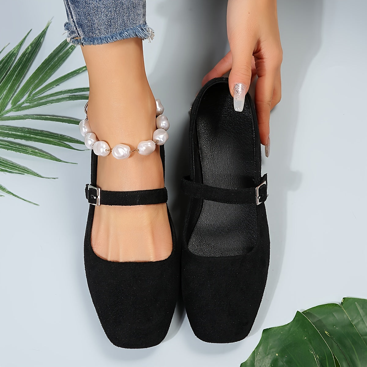 Women's comfortable solid colored flat shoes with square toe and buckle strap.