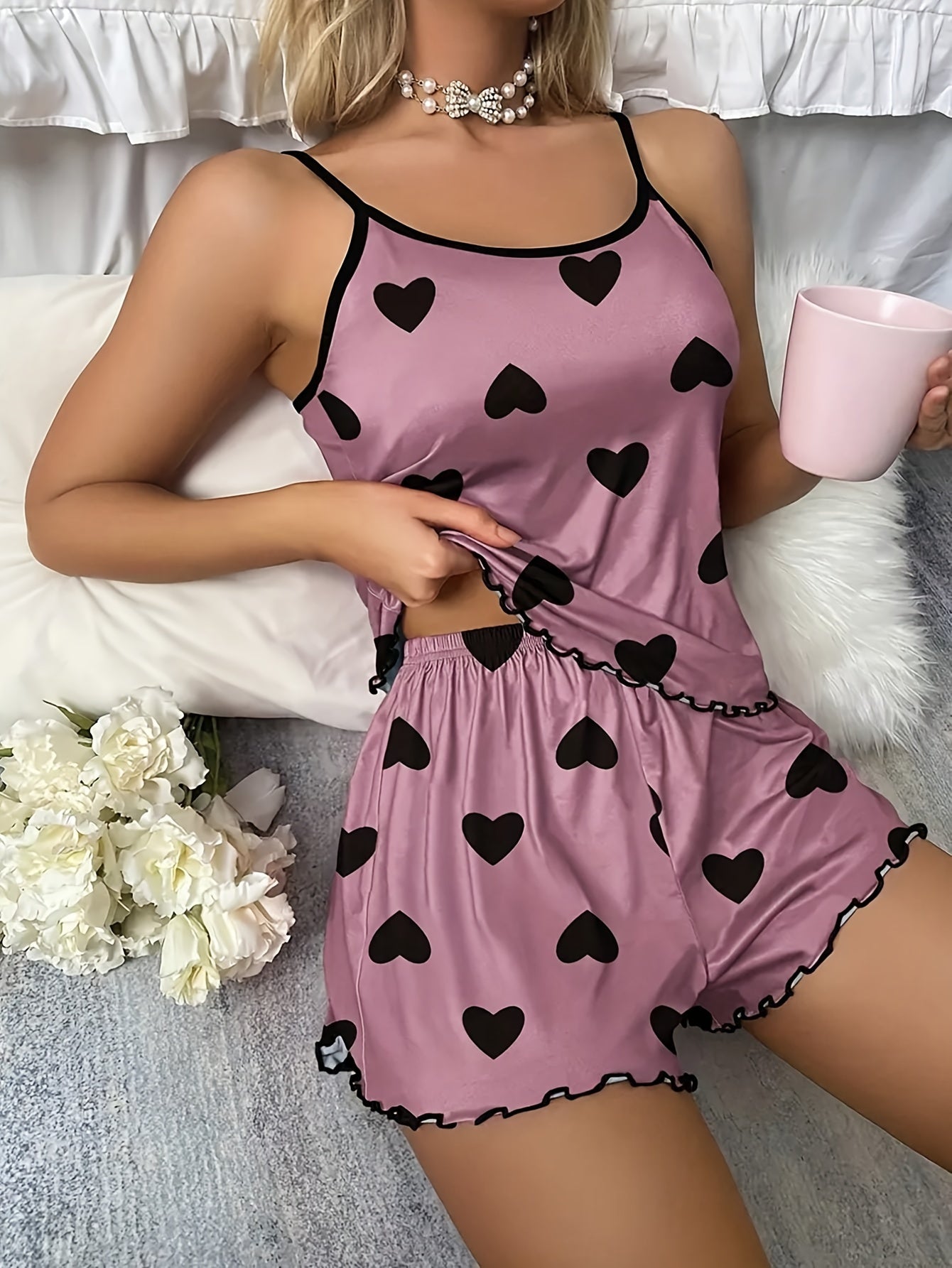 Valentine's Day pajama set for women with heart print, lettuce trim, crew neck backless cami top, and elastic shorts. Perfect for sleepwear and loungewear.