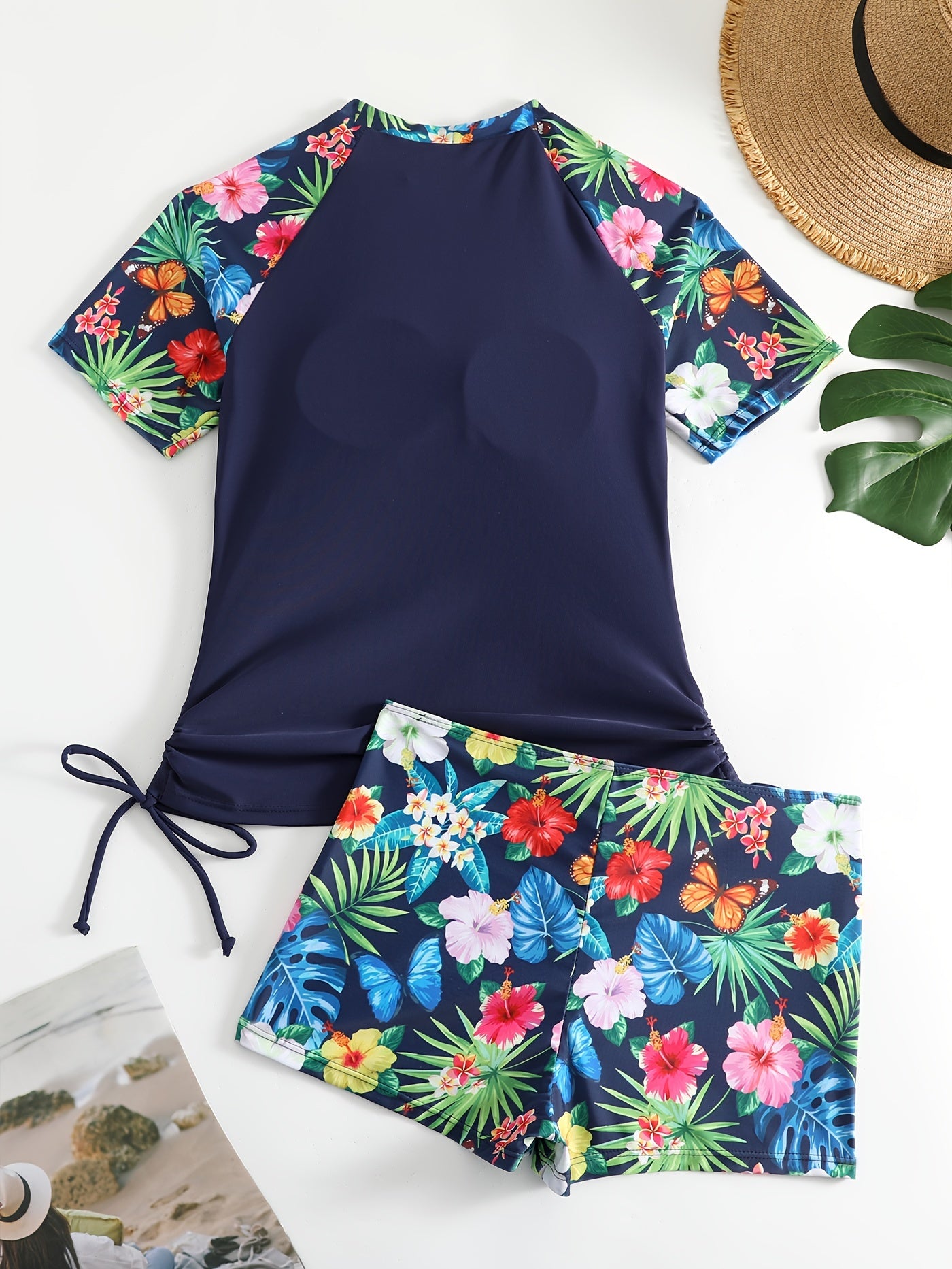 Two-piece tropical plant print rush guard tankini set with sun protection top and boxer shorts swimsuit for women's surfing and water sports.