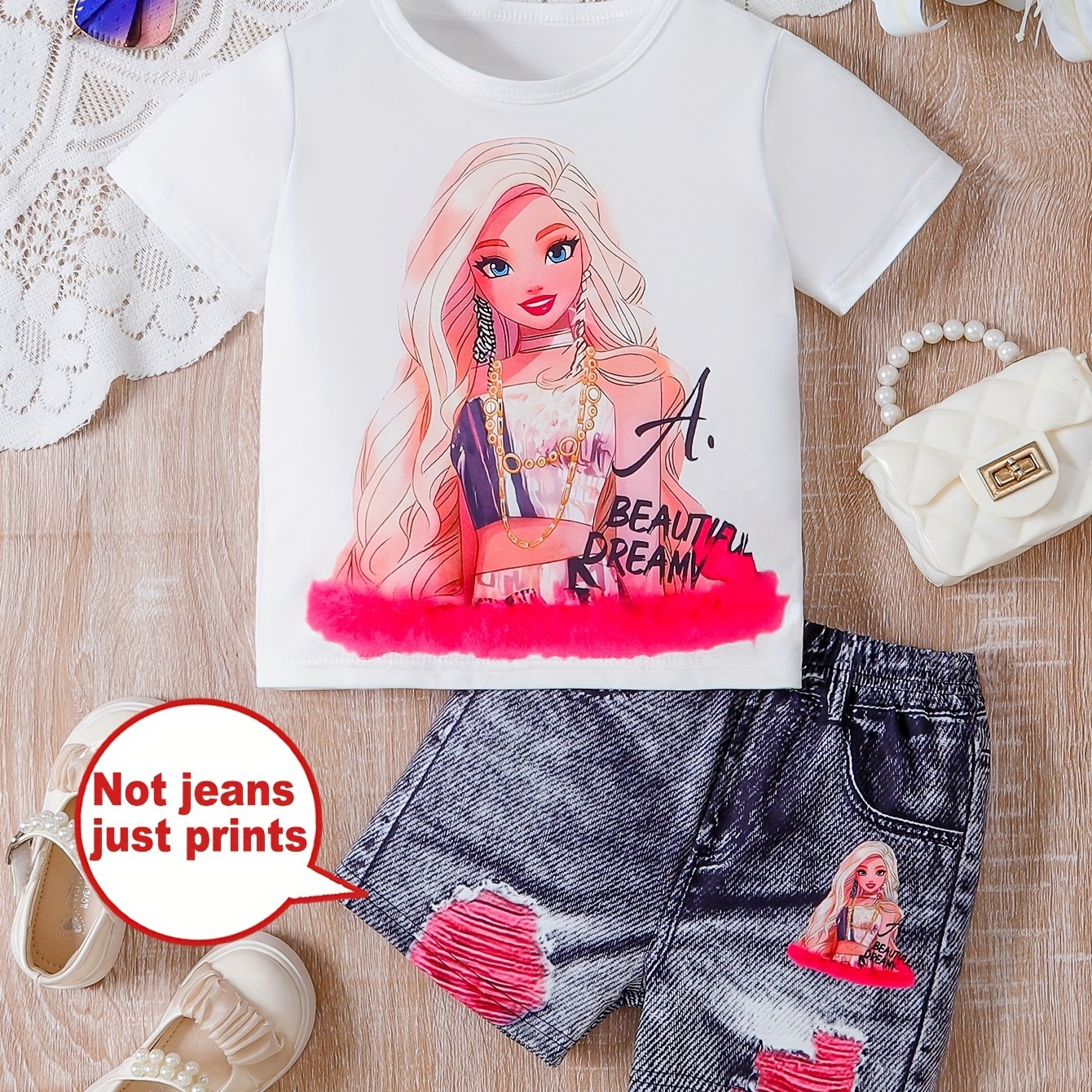 Cartoon print girls' short sleeve top and graphic shorts set, perfect for outdoor summer activities