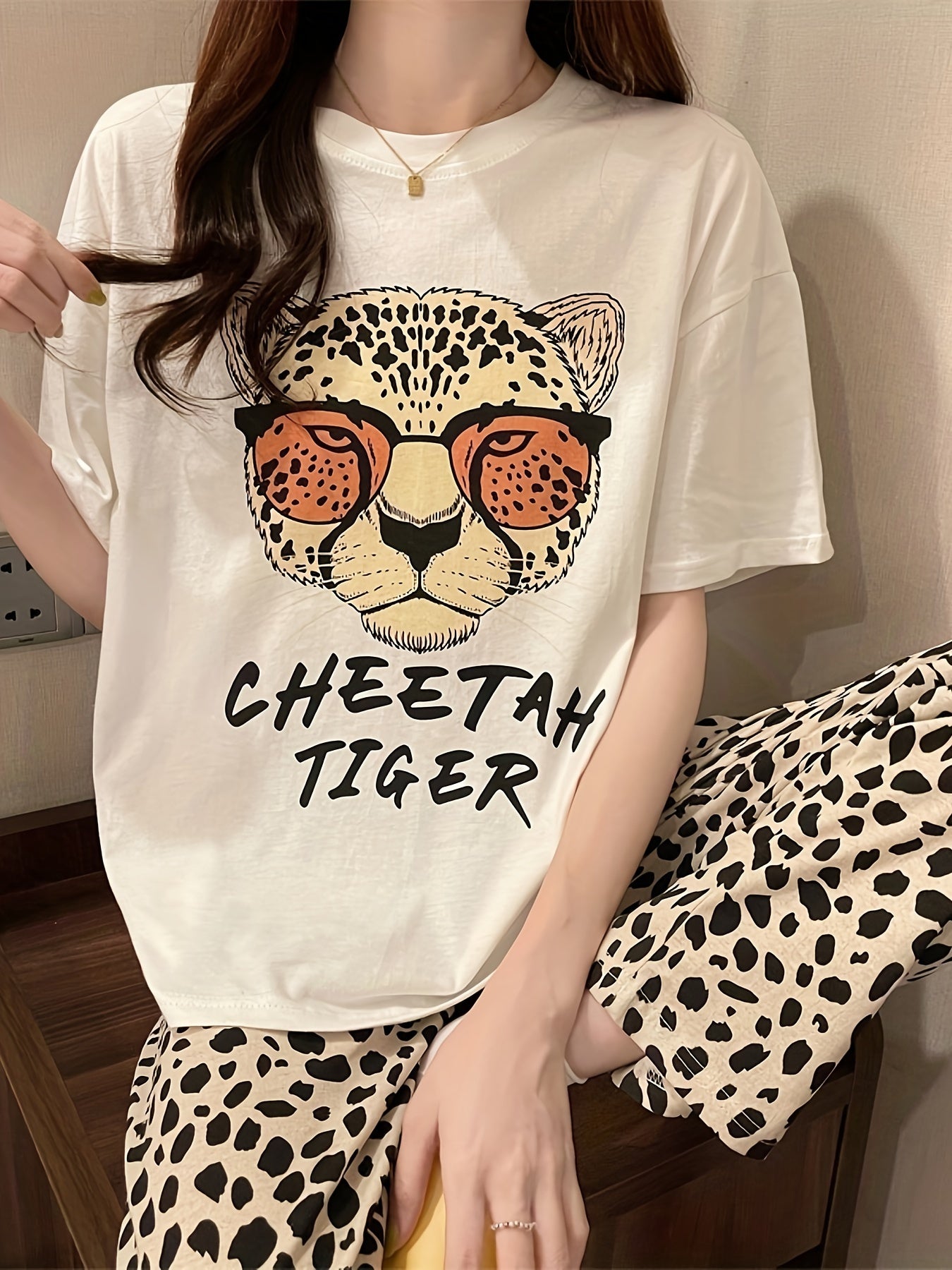 Casual pajama set for women with leopard and letter print, featuring a short sleeve top and matching pants for a comfortable fit.