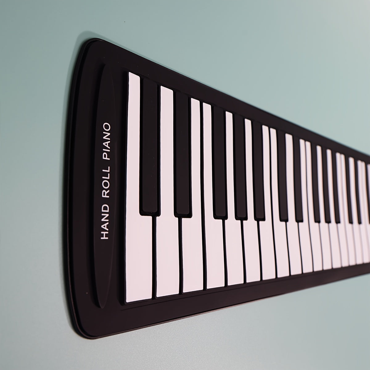 Micro Poly 49-Key Portable Roll-Up Piano Keyboard with Silicone Keys in Black. USB & Battery Powered, Ideal for Beginners. Compact and Easy to Carry Design, Perfect for Home Use. Includes