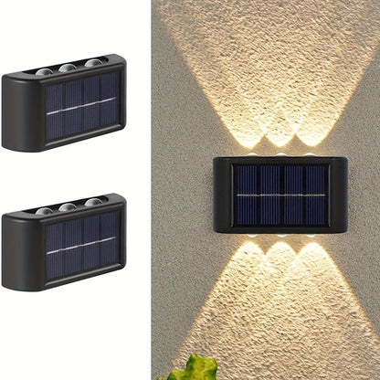 2 solar LED lights for outdoor decoration, easy to install on garden walls.