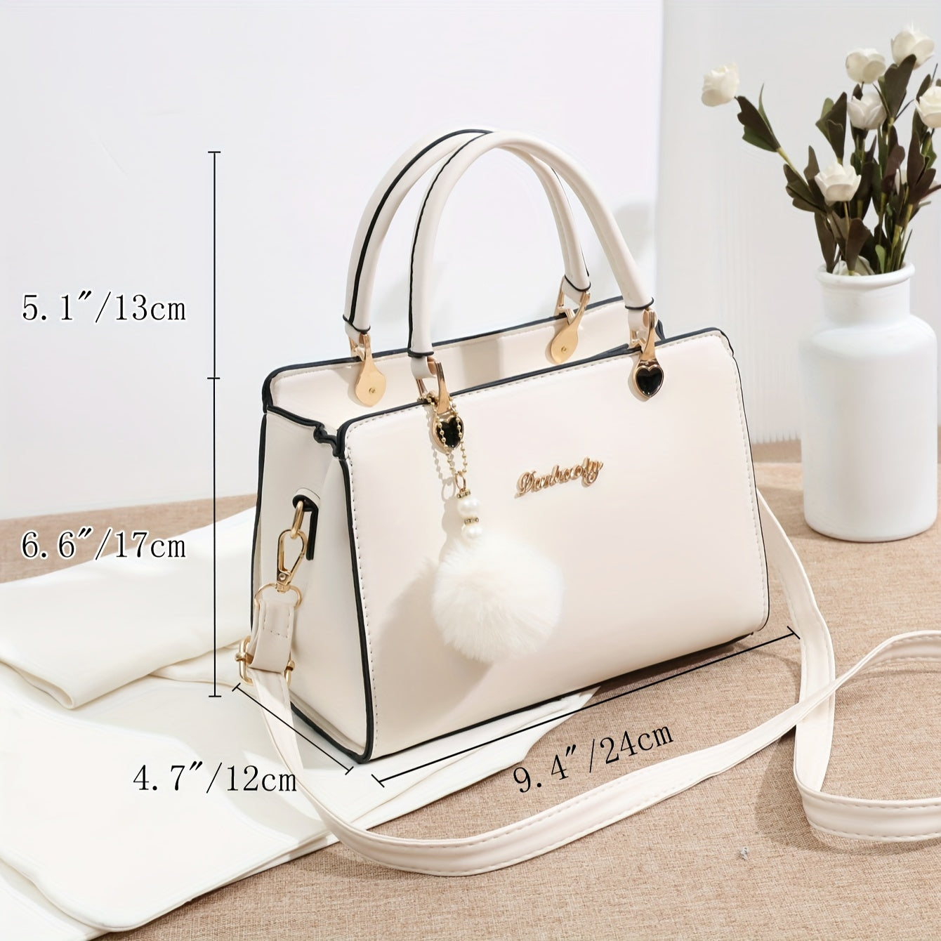 Solid color handbag with multi-layer crossbody design, satchel purse for women with pompom ball charms.