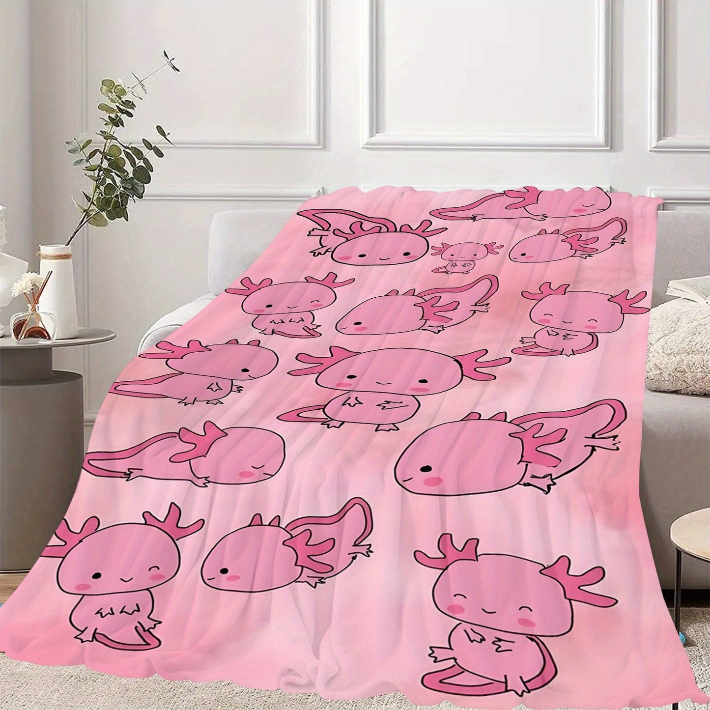 Soft, warm, and lightweight pink cartoon salamander print fleece blanket made of comfortable polyester flannel. Ideal for travel and versatile for all seasons, this contemporary style blanket is the perfect gift for boys, girls, and adults. Machine