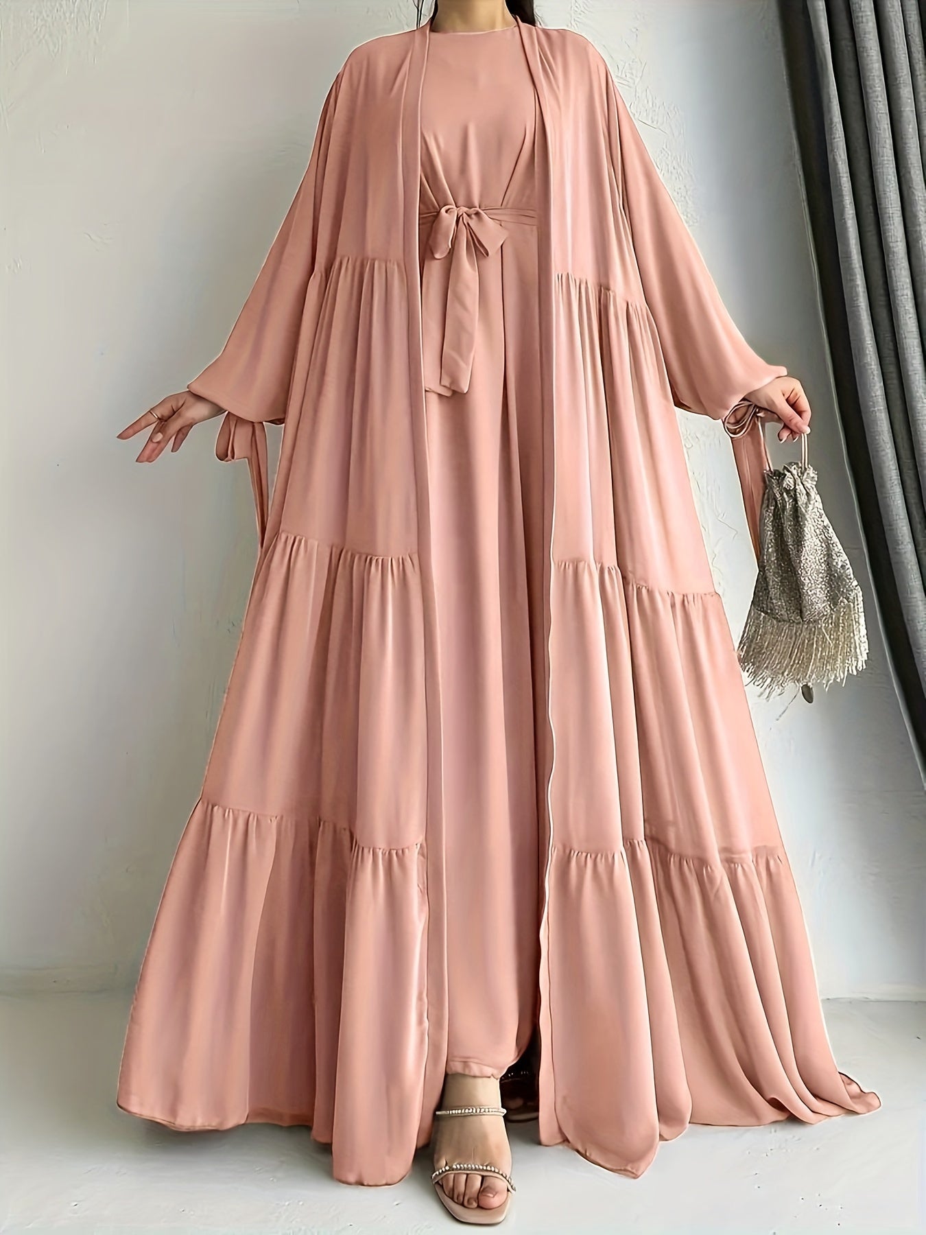 A stylish Middle Eastern Abaya set with vest and belt, featuring a chiffon H-Line robe with side split, lantern sleeves, and ruffle hem detail - perfect for all seasons.