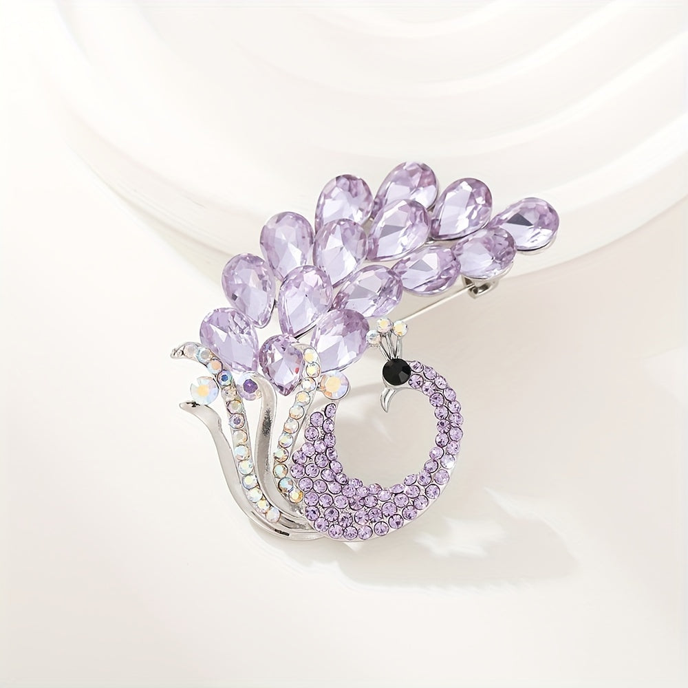 A beautiful purple crystal brooch pin, featuring an elegant and unique design with rhinestones. This fashion accessory is made from high-quality alloy material and showcases a stunning peacock design, perfect for women who appreciate stylish and