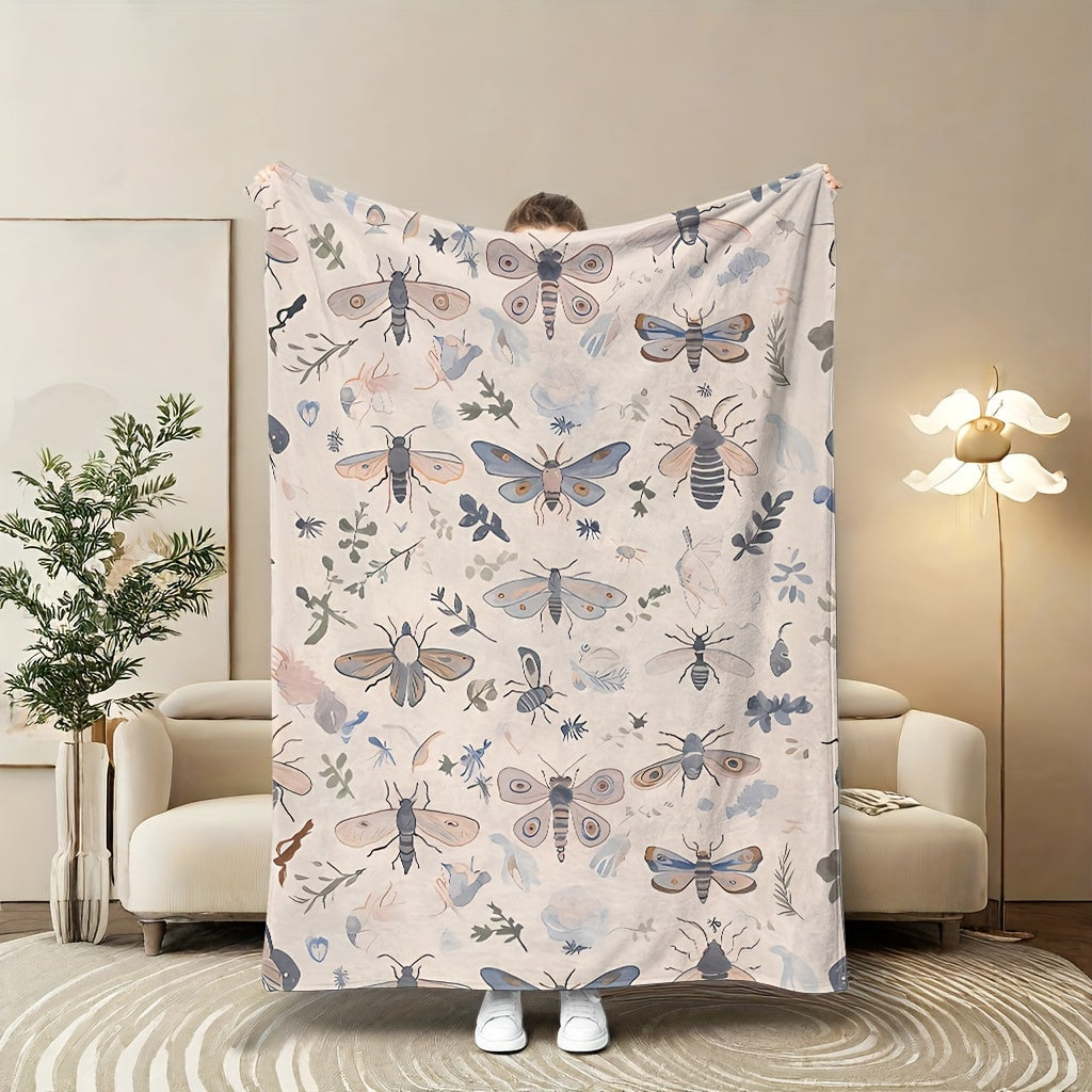 Stay cozy with our contemporary insect pattern throw blanket! Featuring a digital print design, this soft and warm blanket is made from coral fleece and polyester knit fabric. At 180-200g, it provides lightweight warmth perfect for all seasons. Use it on