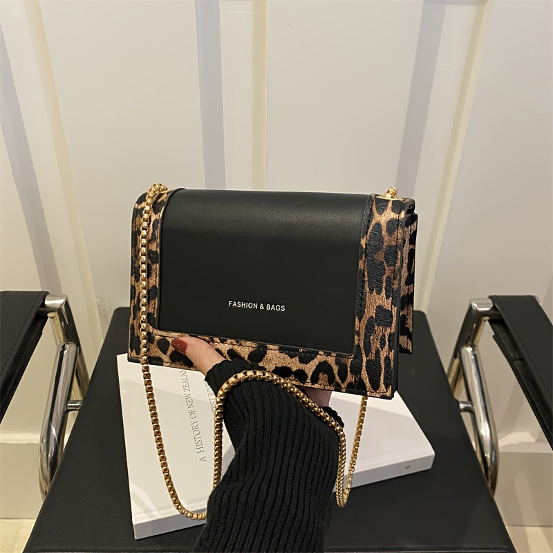 Stylish leopard print crossbody bag for women in black synthetic leather with golden-tone chain strap. Magnetic closure and large capacity, suitable for work, travel, and everyday use.