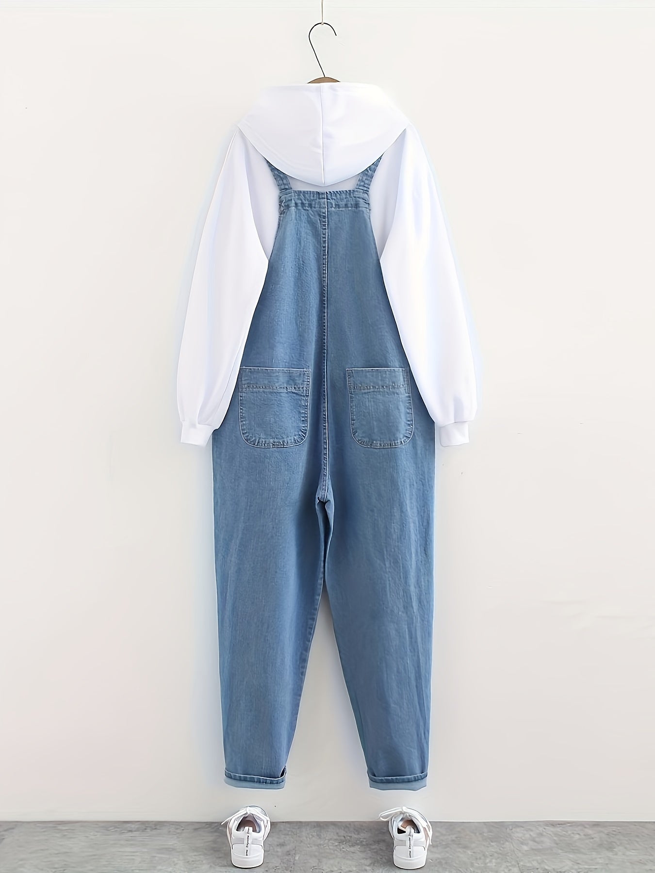 Women's casual style denim overalls in light washed blue, loose fit, also available in denim jeans & clothing.