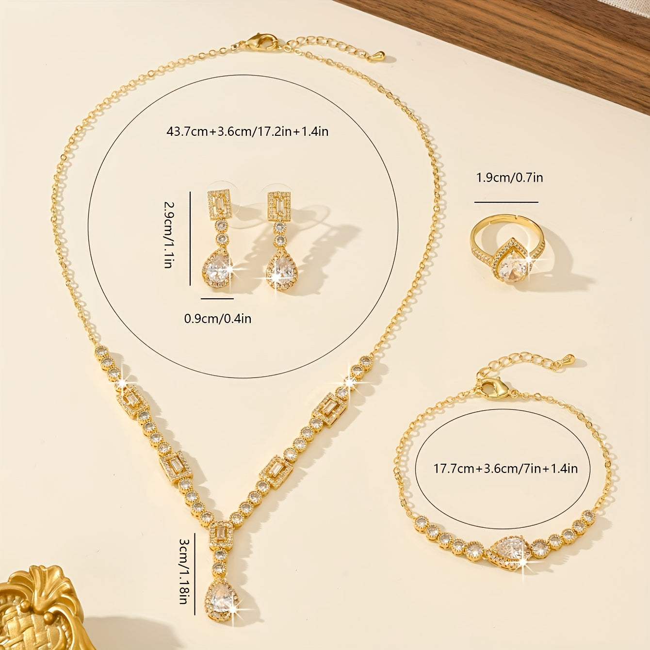 Luxury Jewelry Set Featuring 5 Pieces, Crafted from 18K Golden Plated Copper with Synthetic Cubic Zirconia Stones in a Geometric Teardrop Design. Includes Necklace, Earrings, Ring, and Bracelet, Perfect for Both Daily Wear and Wedding Occasions.