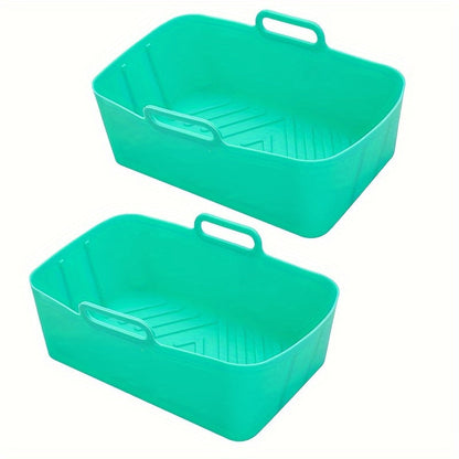 Two food-grade silicone air fryer liner trays, rectangular oven mats for baking pans, perfect for flat bottom pots. They are easy to clean, reusable, and resistant to high temperatures. These non-stick baking pans are an essential addition to your