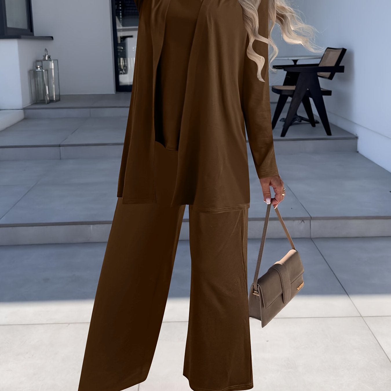 Women's suit set includes solid color split round neck sleeveless vest top, long sleeve open coat, and wide leg pants.