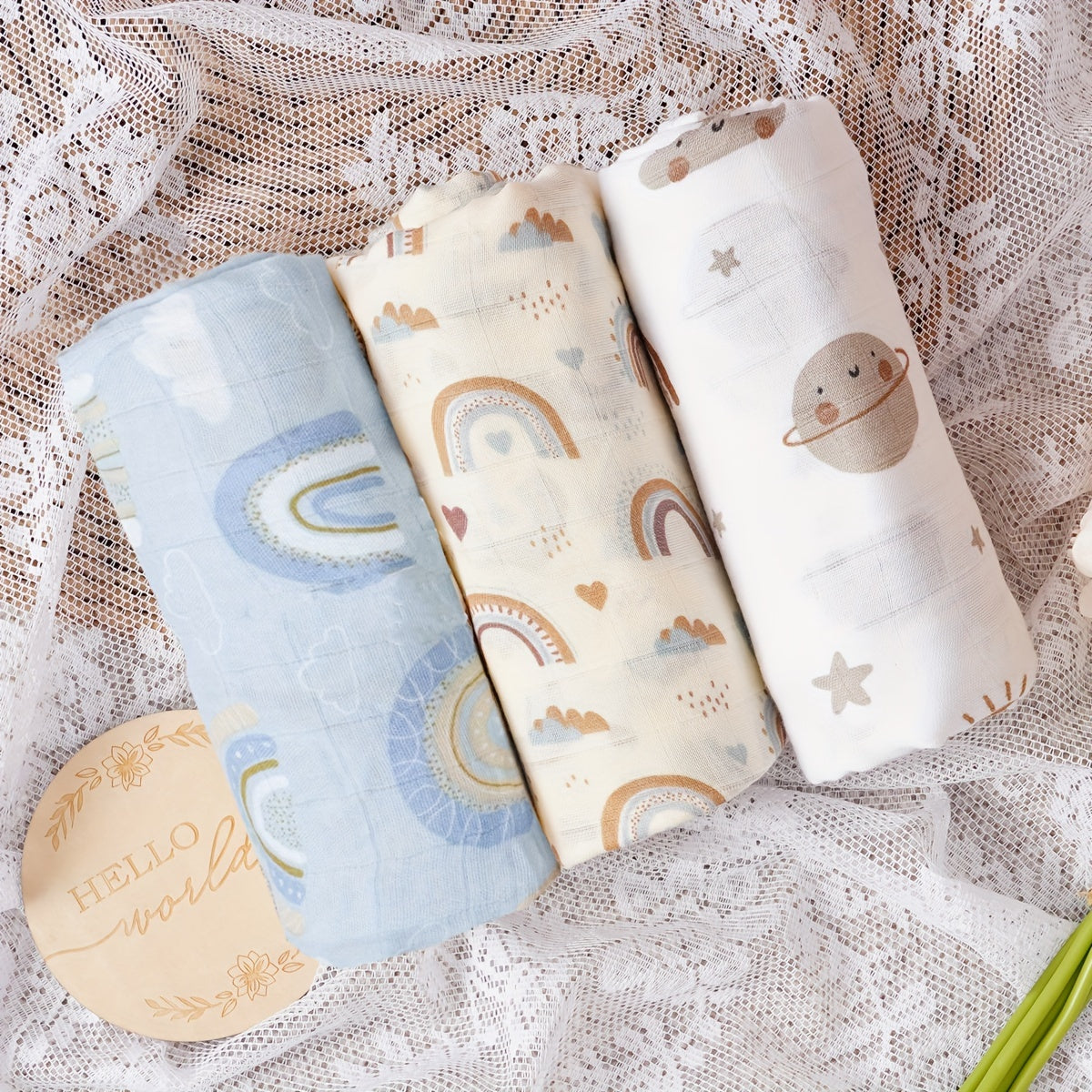 Three Elinfant Swaddle Blankets made from bamboo cotton muslin for newborns. These soft gauze bath towels are recommended for hand washing only and are suitable for children aged 0-3 years old.