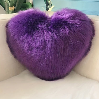 Heart-shaped throw pillow for living room or bedroom, made of long plush material for softness and comfort.