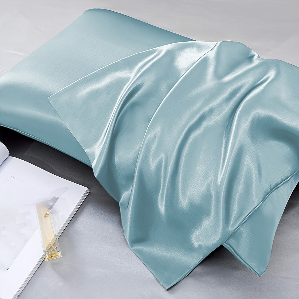 Two-pack of luxurious silky satin pillowcases, made from ultra soft smooth polyester with an envelope closure design. Available in solid colors, these machine washable pillow covers are lightweight at 80-85gsm, providing cooling comfort for hair and