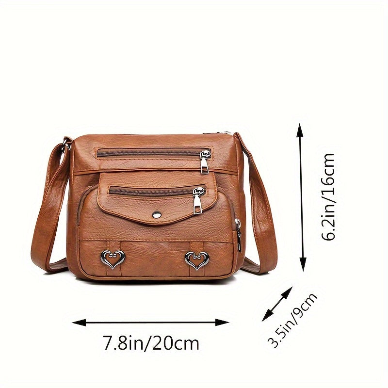 Square bag with multiple pockets and adjustable strap, suitable for travel. Zipper direction random.