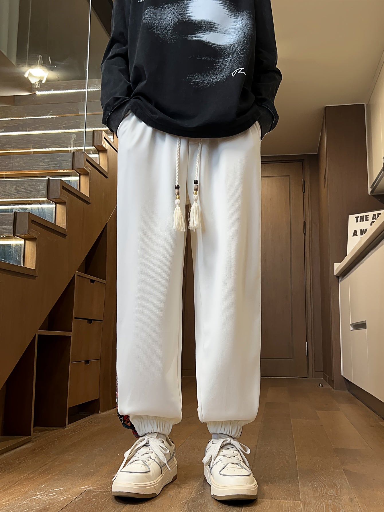 Men's stylish long pants with ethnic style patchwork and letter embroidery, casual jogger sports trousers.