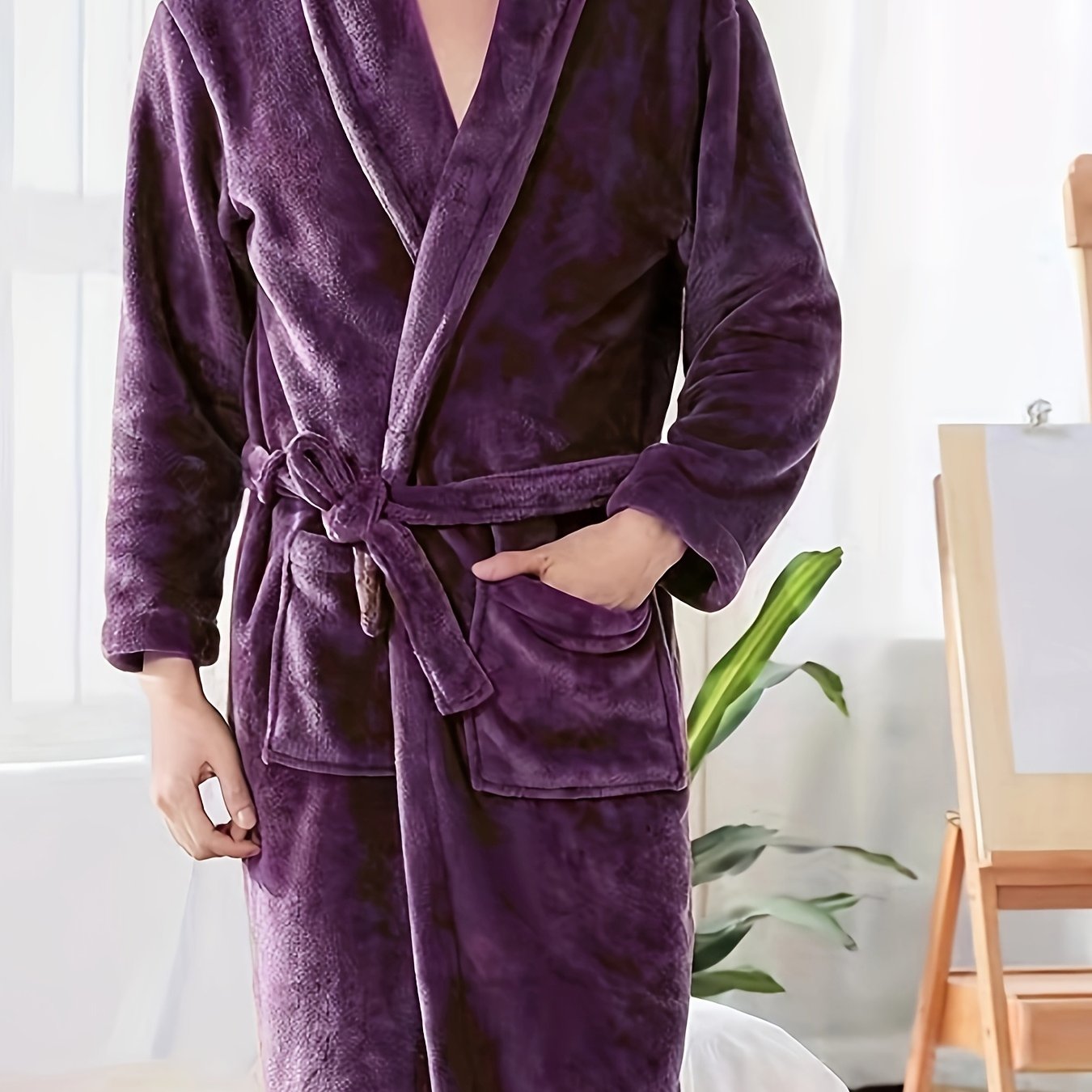 Luxurious plush fleece bathrobe for cozy autumn/winter comfort. Features thick, warm material, long sleeves, v-neck, tie belt, and is machine washable.