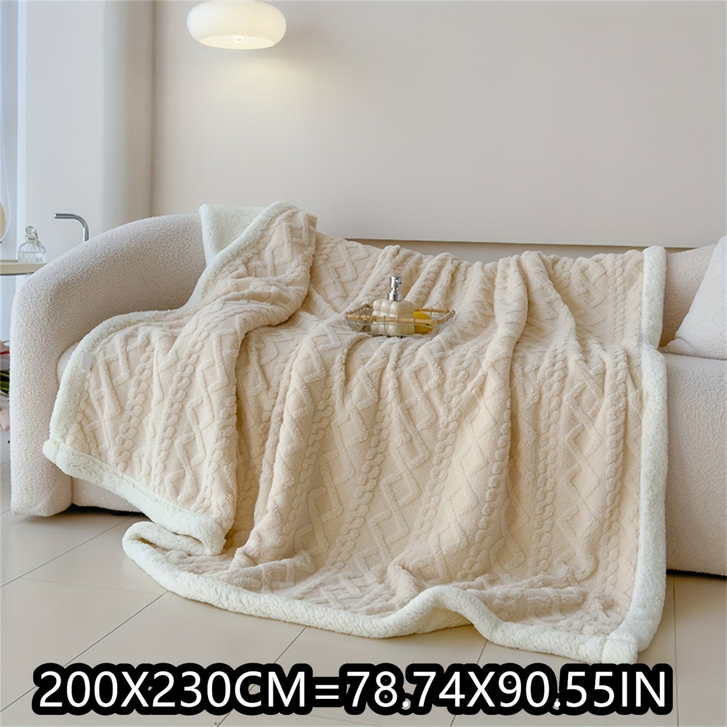 Soft cable-knit fleece blanket in blue, available in 150x200cm or 200x230cm sizes. Featuring a contemporary style, this blanket is machine washable and perfect for use in the bedroom, living room, office, or while camping during the winter. Made with a