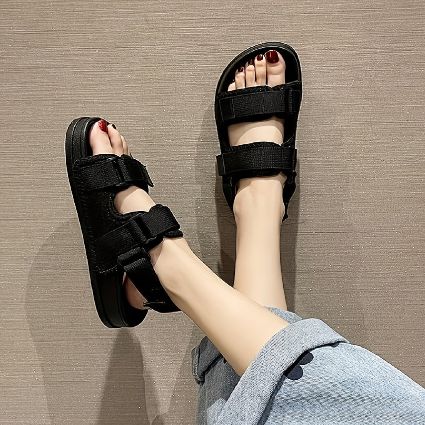 Women's stylish black summer beach slide sandals with adjustable hook-and-loop fastener straps, flat heel, open toe, PVC sole for easy cleaning and comfort.