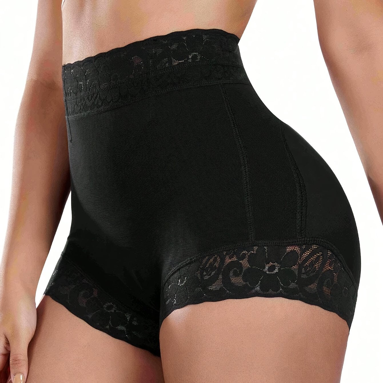 High-waist black shaping shorts with lace detail for tummy control and butt lifting. Made of stretchy nylon and elastane blend. Hand washable with smooth finish. Mid-thigh length and high