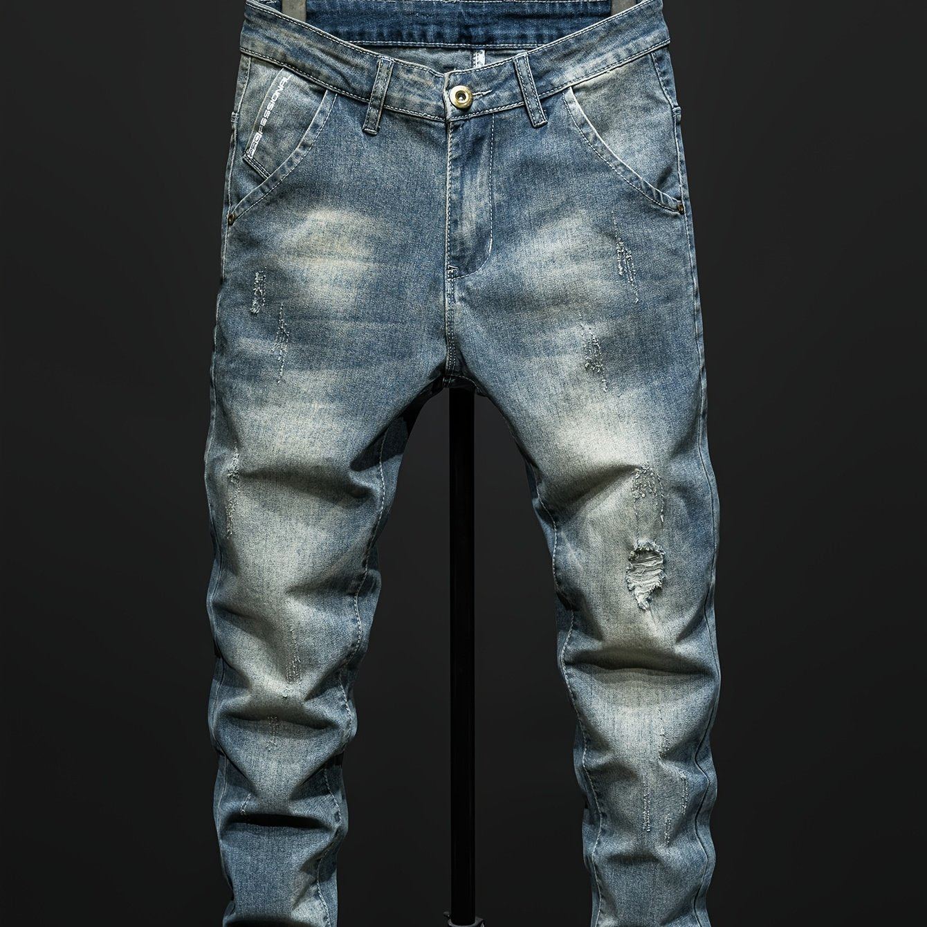 Men's Distressed Ripped Jeans in Regular Fit, made with 74.70% Cotton, 23.70% Polyester, and 1.60% Elastane. Solid color, all-season wear with slight stretch and washed finish. Woven fabric