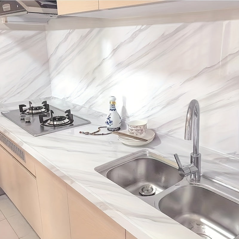 White marble self-adhesive kitchen backsplash wallpaper is oil, heat, waterproof, and mold resistant, perfect for cabinets, stovetops, and countertops. Easy to install stove top protectors.