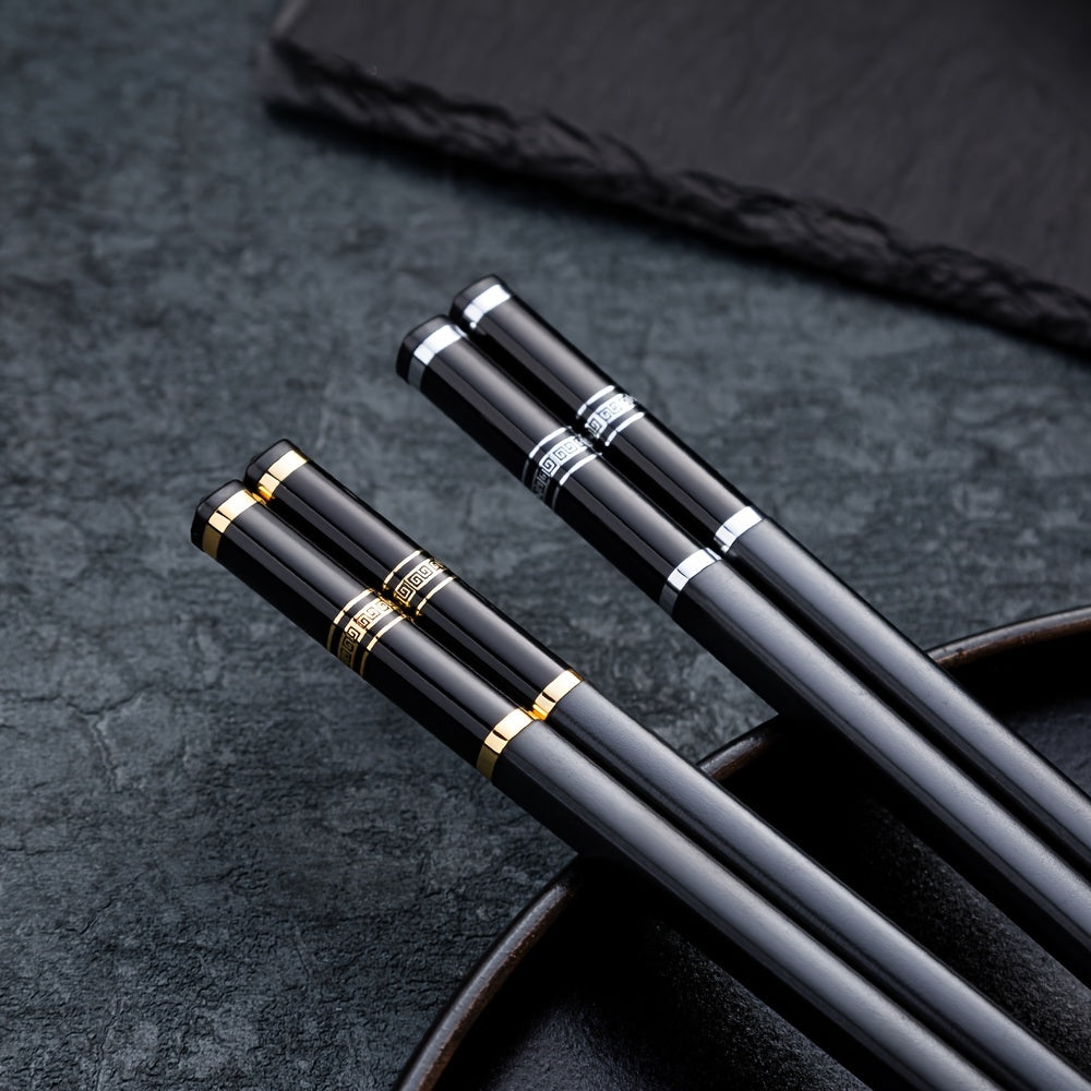 5 pairs of reusable alloy chopsticks with embossed Great Wall pattern, perfect for fast food, noodles, sushi, and ramen. Luxurious and stylish.