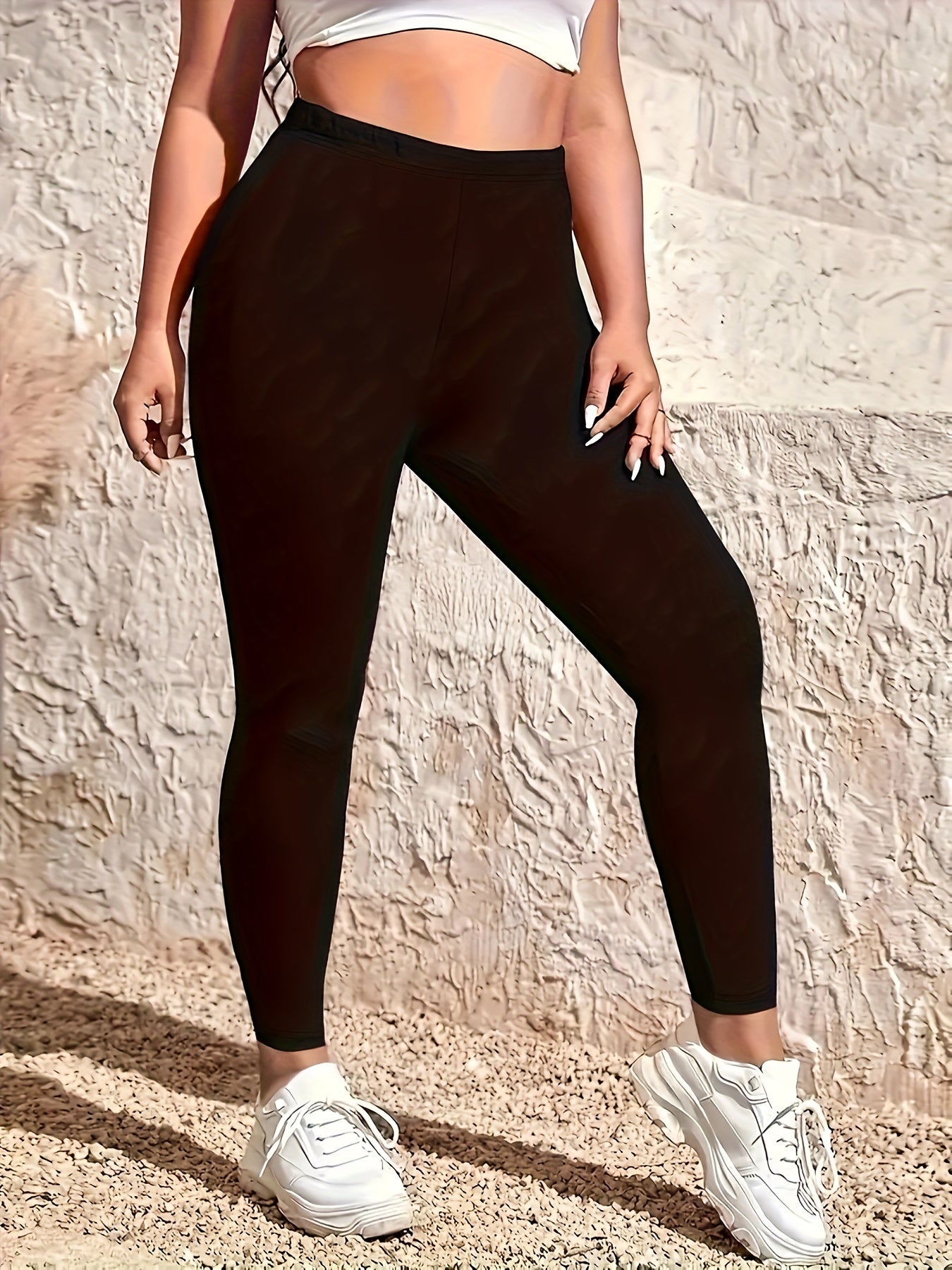 High-waist solid color leggings for plus-size women, perfect for spring and summer casual wear.