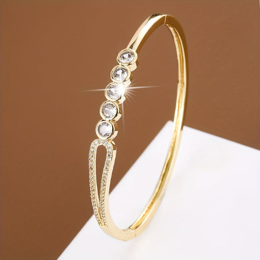 A bracelet for women featuring a circular bead ring clasp adorned with zirconia stones.