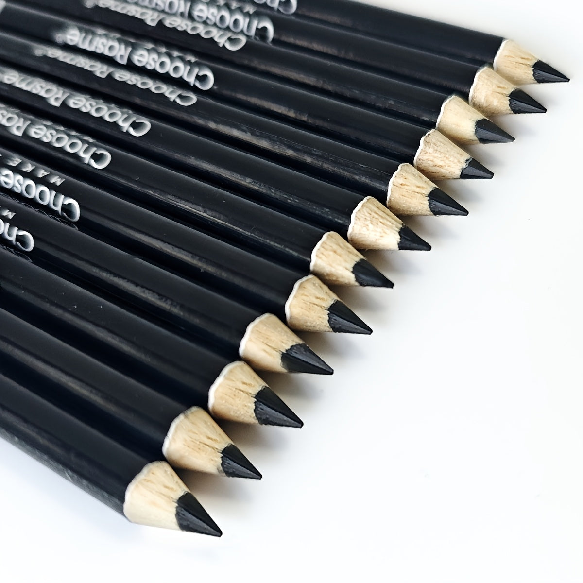 12pc black eyeliner pencil set with long-lasting, smudge-proof formula, intense pigment, and waterproof finish.