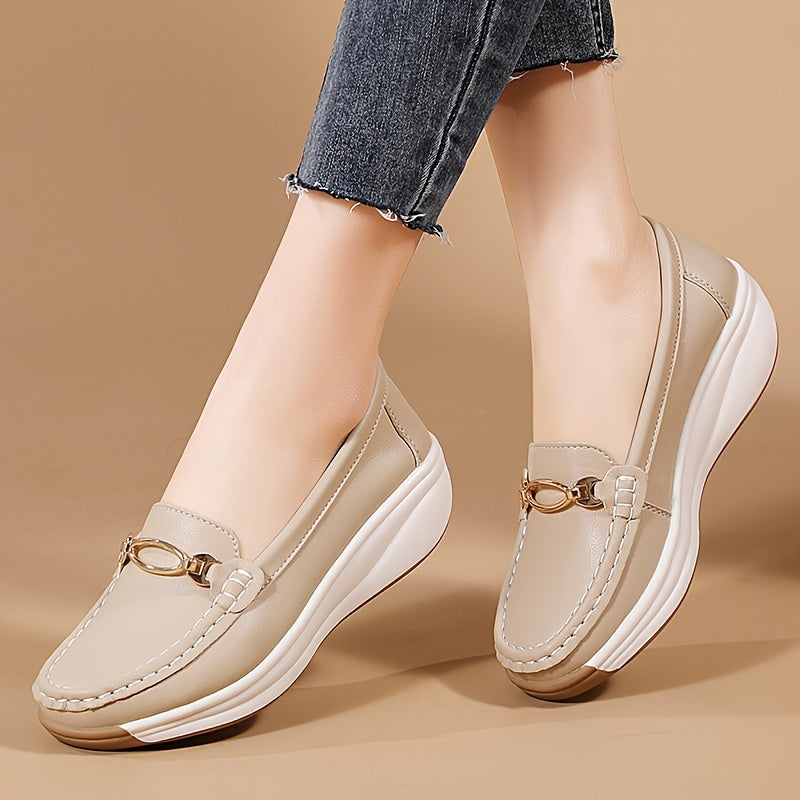 Versatile beige slip-on loafers for women with thick, non-slip soles and decorative buckle detail. Comfortable and lightweight for all-season wear.