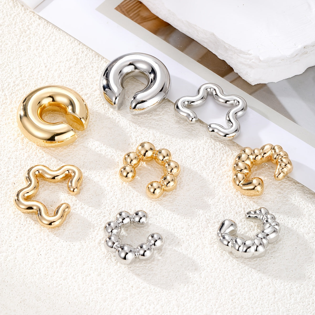 Punk-inspired Minimalist Geometric Irregular C-Shaped Ear Cuff Set includes 8 pieces. Features a Simple Style with an Alloy construction and a Script-and-numeric-symbols Theme. Perfect for daily wear or as a gift for any occasion. Suitable for all