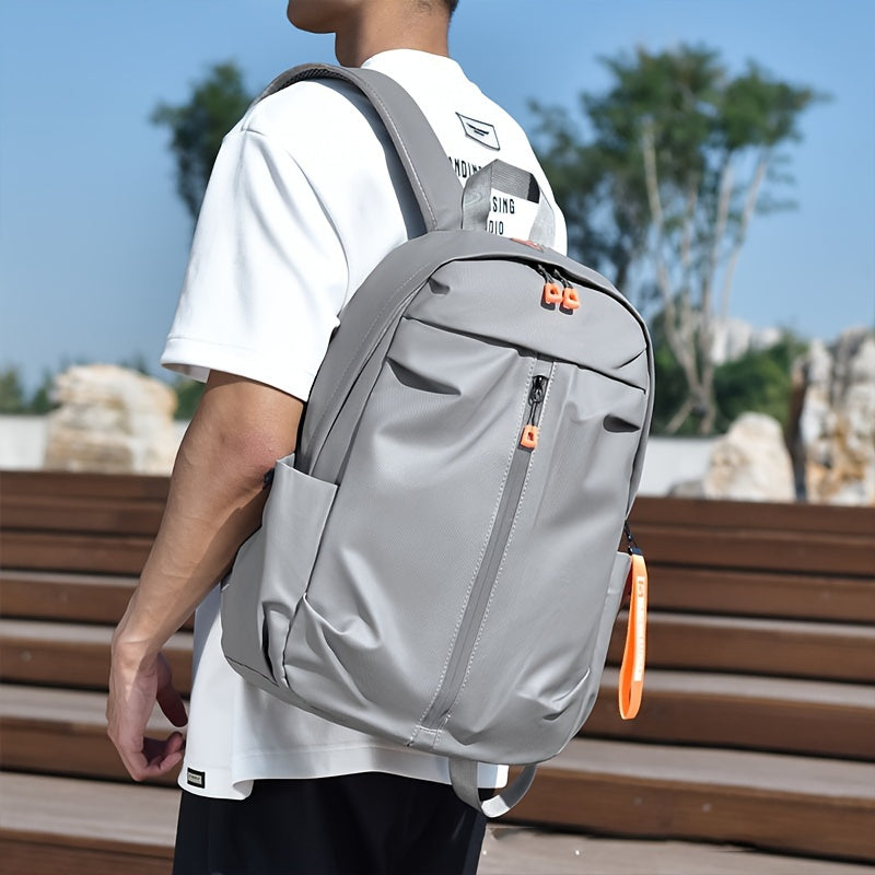 Men's light gray backpack made of stylish polyester with zippered compartments, adjustable straps for school and outdoor travel.