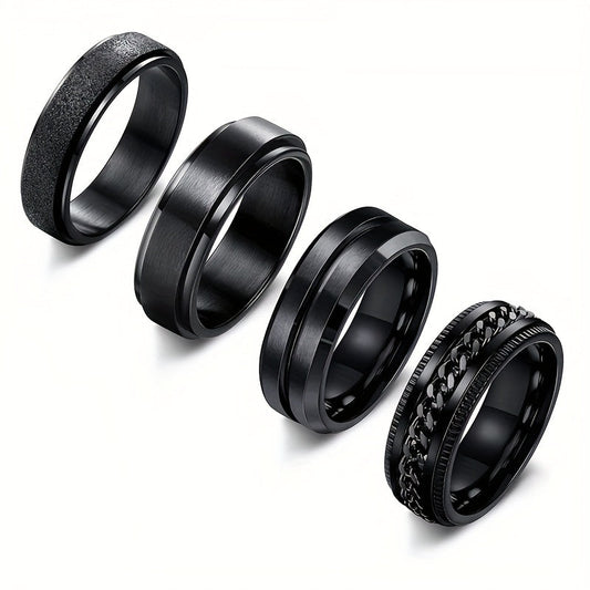 Four minimalist and stylish black rotating rings featuring concave grooves, designed for men with a matte finish. These rings are perfect as fashionable accessories.