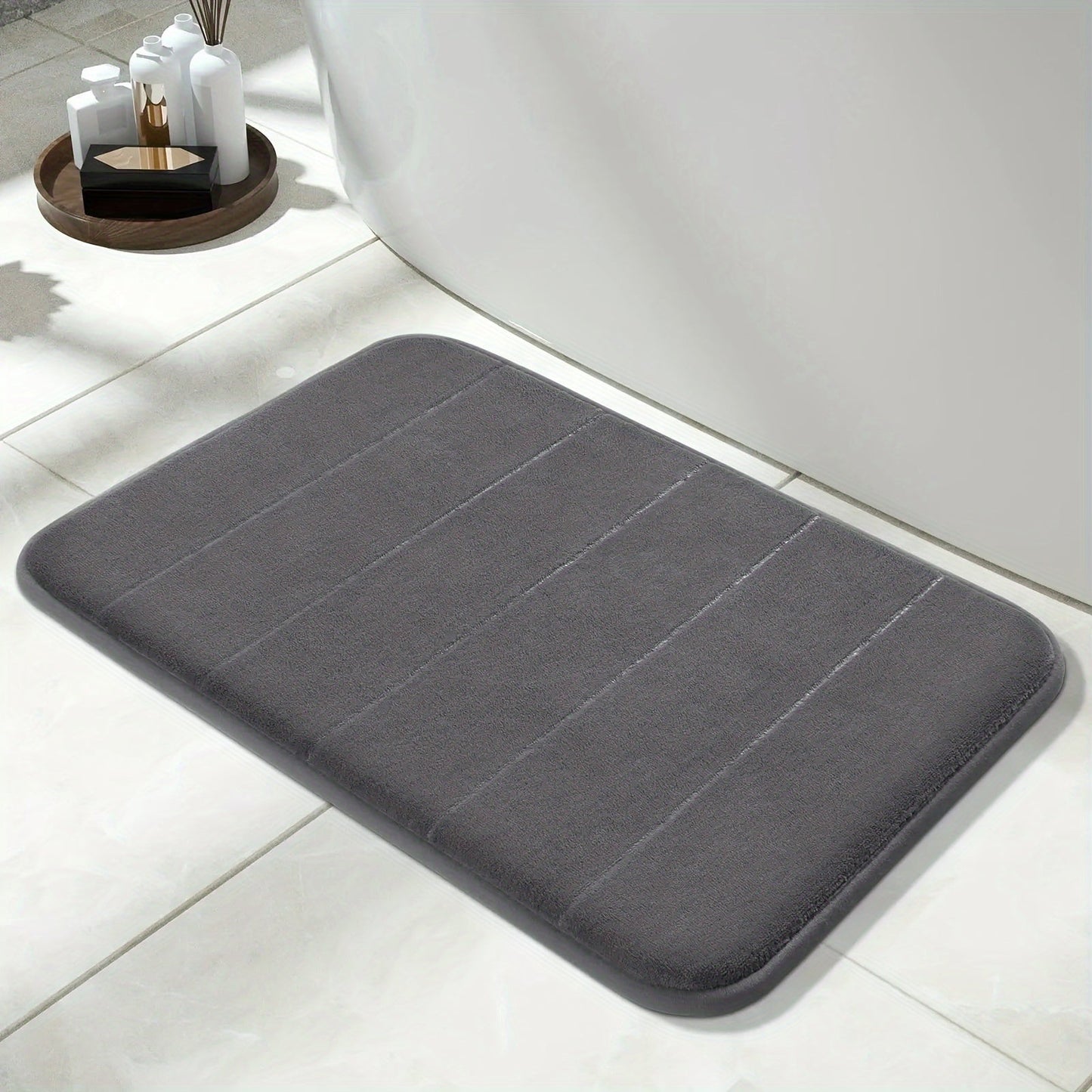 1 piece of Memory Foam Bath Mat designed for the bathroom, featuring a non-slip surface and thickened soft material that quickly absorbs water and dries fast. This machine-washable mat can also be used as a shower mat, living room or bedroom entrance