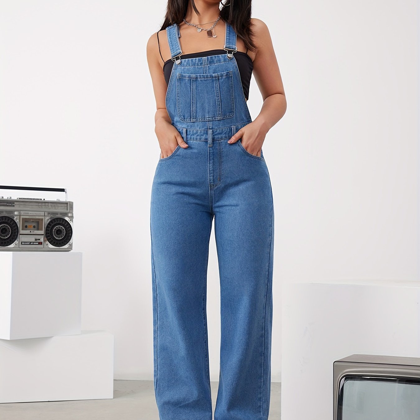 Women's adjustable denim overalls with wide-leg jeans, button detail, and machine washable.