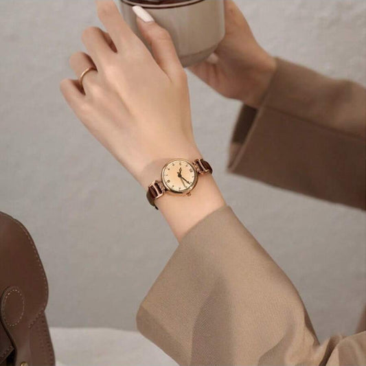 Elegant vintage-inspired women's watch with quartz movement and synthetic leather strap, non-rechargeable button battery.