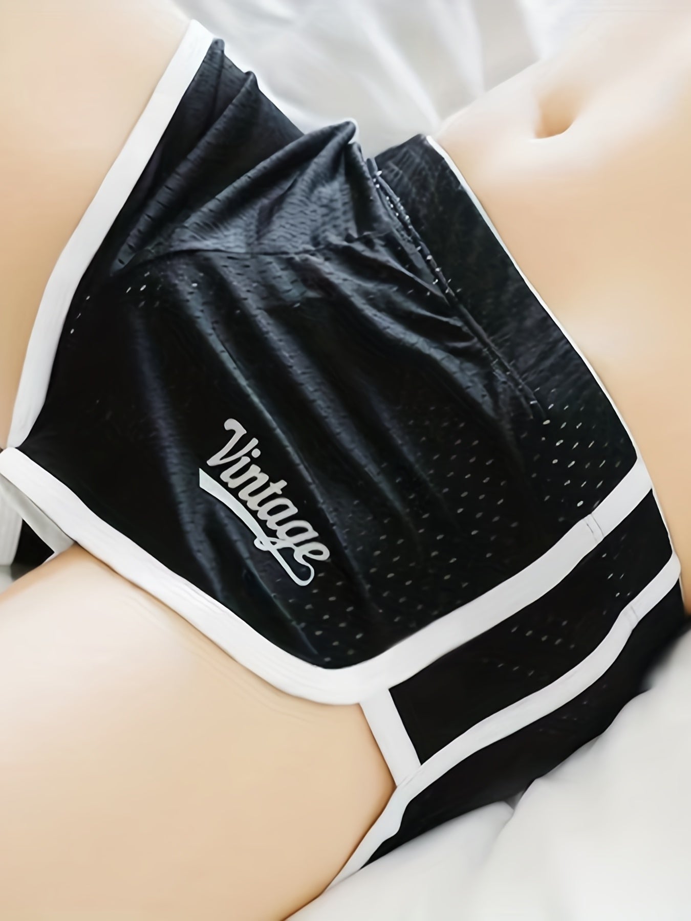 Breathable mesh boxer briefs for men with a comfort fit and contrast trim, suitable for everyday wear and sleepwear.