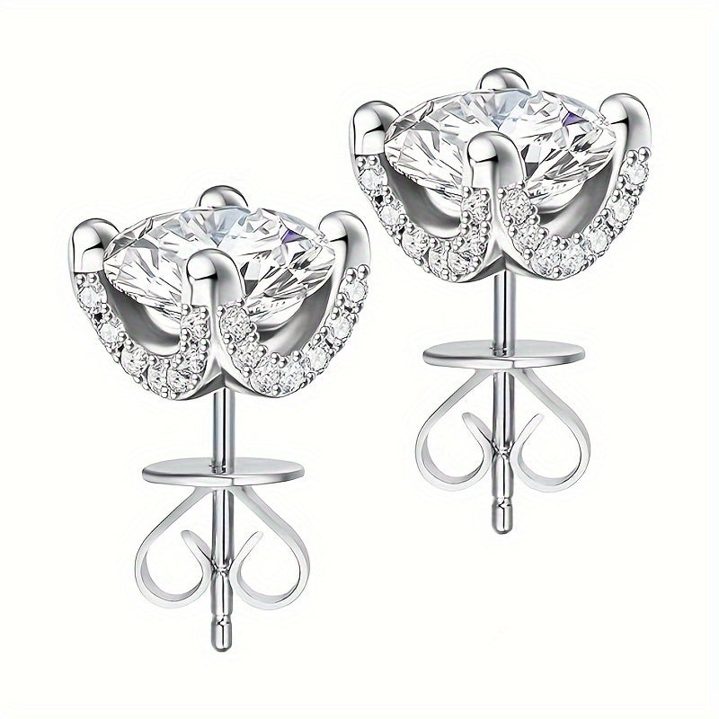 These European and American Fashion Sterling Silver Stud Earrings feature two 1 Carat Moissanite stones set in four claws. They showcase a creative personality with a gorgeous, mature, and luxurious design. These earrings are versatile, perfect for daily