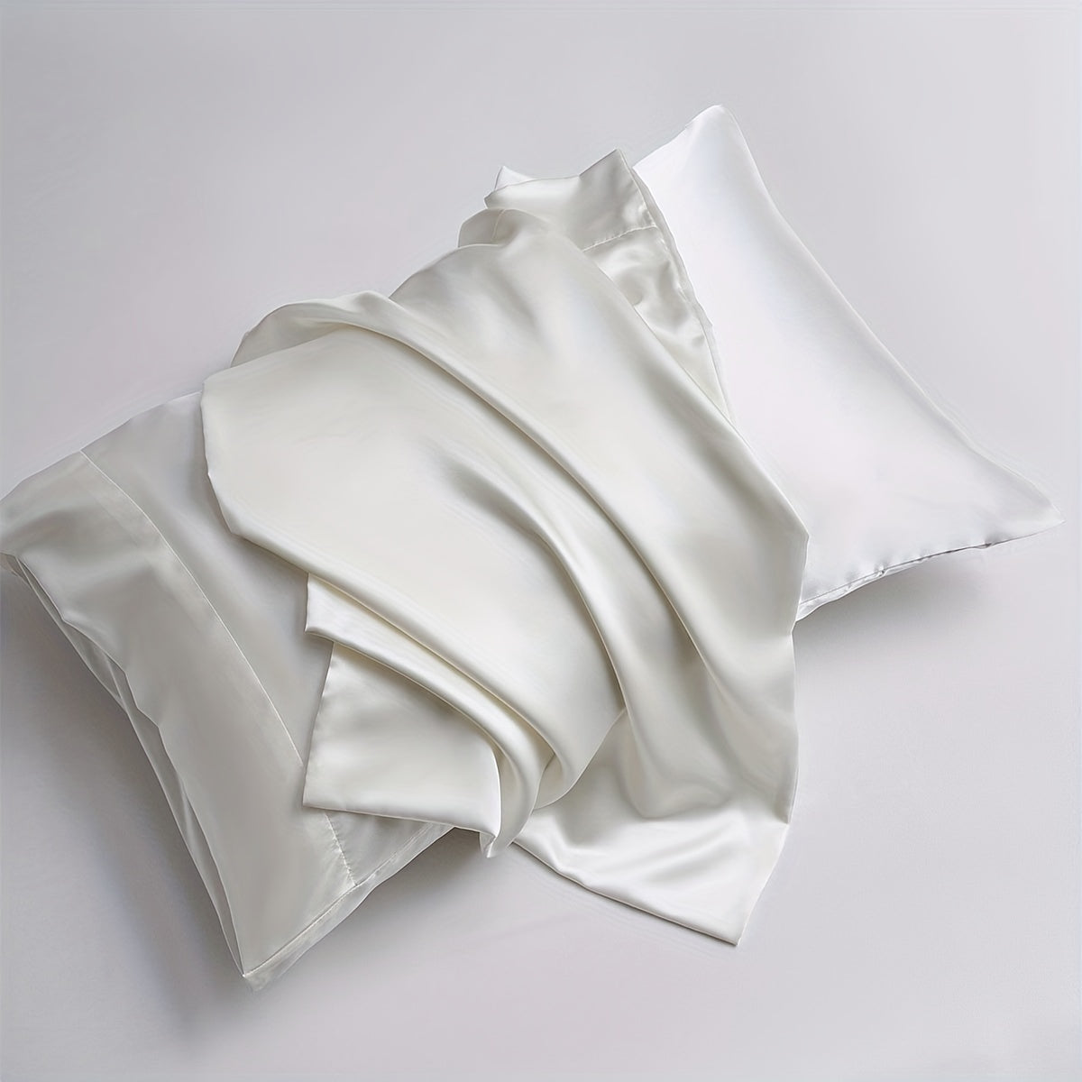 Two pieces of satin pillowcases available in solid colors perfect for the living room or bedroom. Pillow inserts are not included.