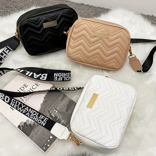 Women's fashion crossbody bag made of stain-resistant synthetic leather with removable strap. Available in khaki, white, and black. Zippered camera bag design.