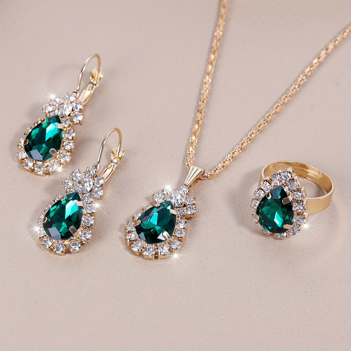 Complete your look with this elegant jewelry set featuring 4 pieces - earrings, necklace, and ring. Made with 18k gold plating and inlaid with shimmering zirconia in multiple colors to suit your style. Perfect for daily wear or adding a touch of glamour