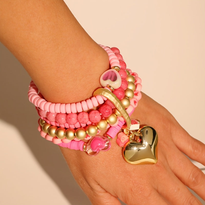 Introducing a versatile Bohemian-style bracelet made of multi-layered pink resin beads, ideal for women looking to elevate their Valentine's Day fashion. Adorned with charming heart inlays, this accessory can be worn for both casual and special