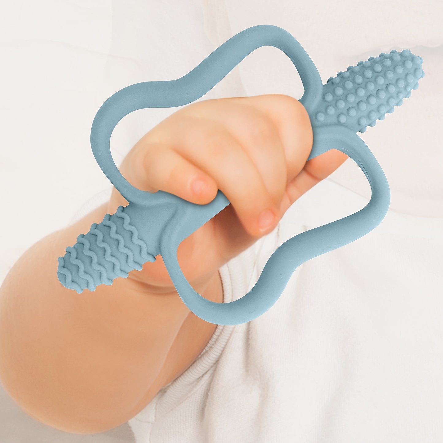 Corn-shaped teething stick with handle, available in 6 colors.