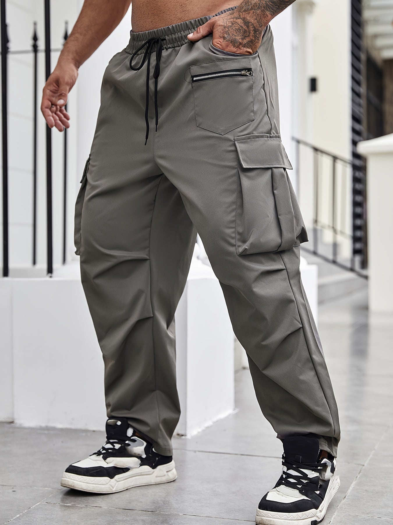 Durable polyester cargo pants for men in plus sizes, suitable for all seasons.