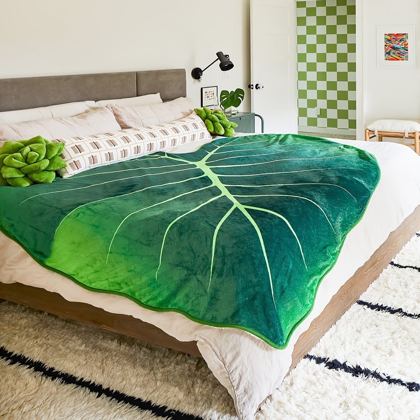 Green leaf-shaped blanket with warm and cozy feel - perfect for couch, bed, and sofa. Features high-definition digital printing.