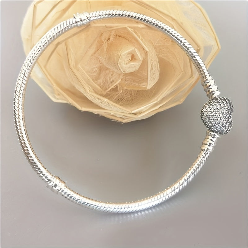 Pair of romantic couple bracelets with double-sided love zirconia lock clasps in a smooth snake pattern design, perfect for wearing to daily parties. Can be paired with a beaded pendant for a matching jewelry set, making it a great gift idea.